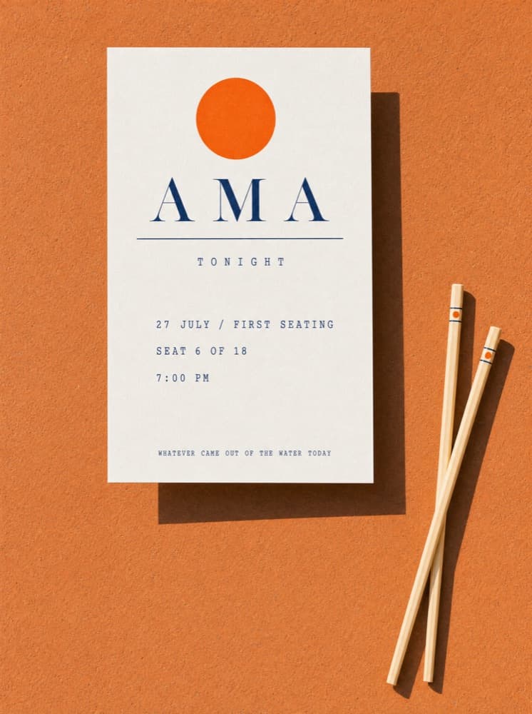 The seat card: Ama, tonight, 27 July, first seating, seat 6 of 18, 7:00 PM, beside a pair of chopsticks